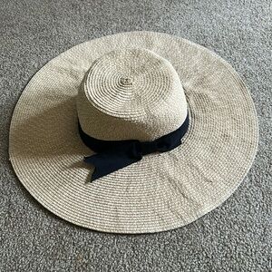 Woman’s Classic Tan Floppy Beach hat with black ribbon trim